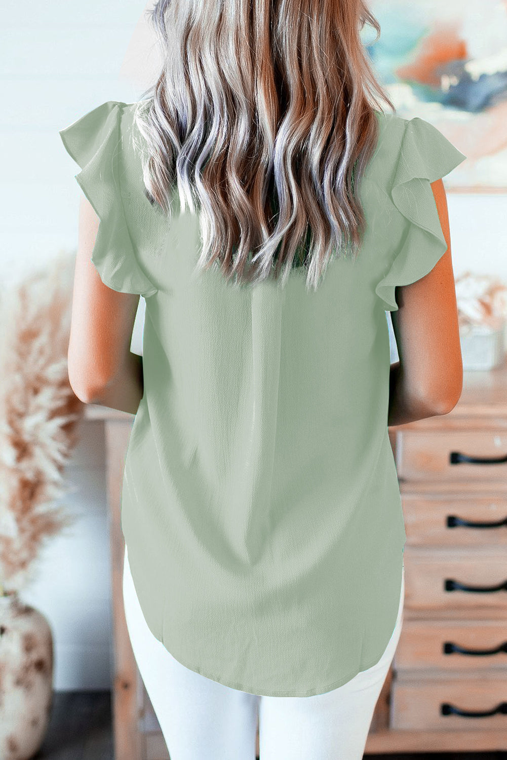 Ruffled Sleeveless V Neck Top